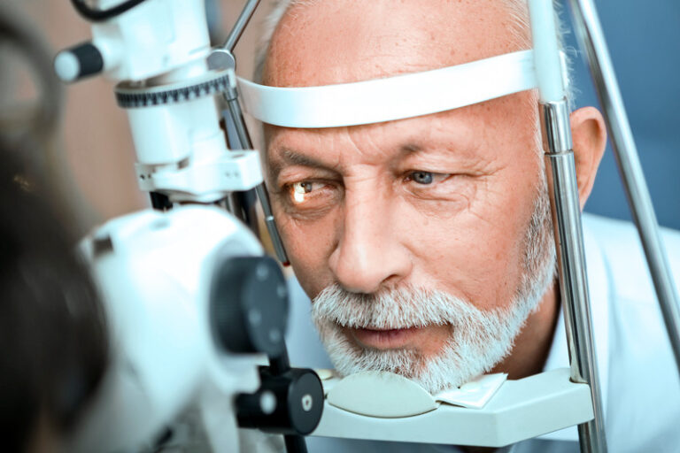 A senior citizen receiving an eye exam