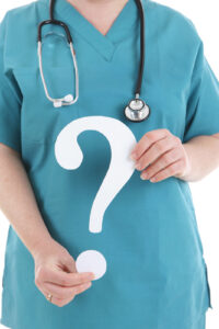 Nurse holding a question mark